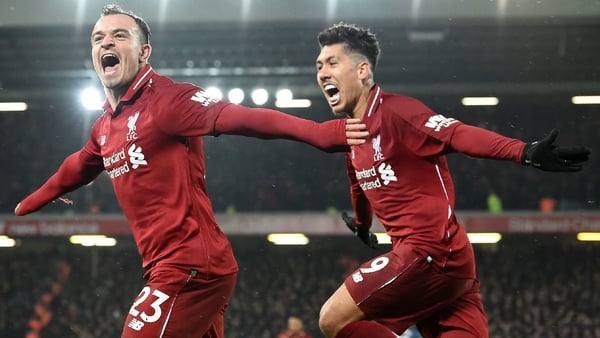 Xherdan Shaqiri (L) celebrates with Roberto Firmino