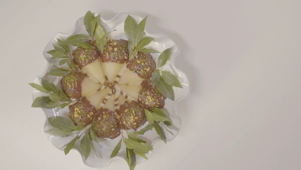 Cardamom Poached Pears with Dark Chocolate CocoaNibs Pistachio and Candied Orange
