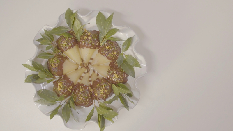 Cardamom Poached Pears with Dark Chocolate CocoaNibs Pistachio and Candied Orange