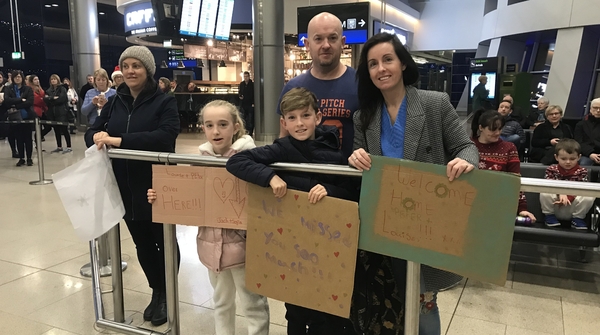 Jack and Sophia Greg wait to welcome home their sister Louise