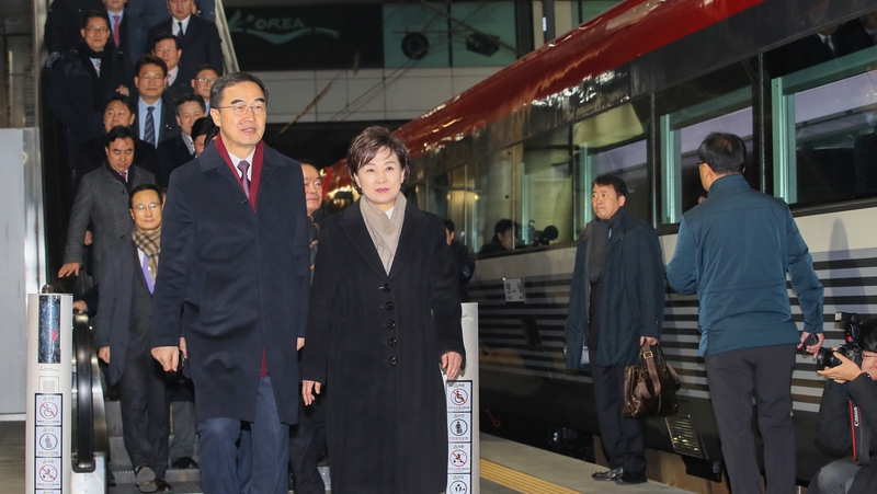 South Korea's Unification Minister Cho Myoung-gyon and others board the train to North Korea ahead of the ceremony