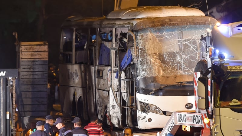 The bus from yesterday's attack in which four people were killed is removed from the scene