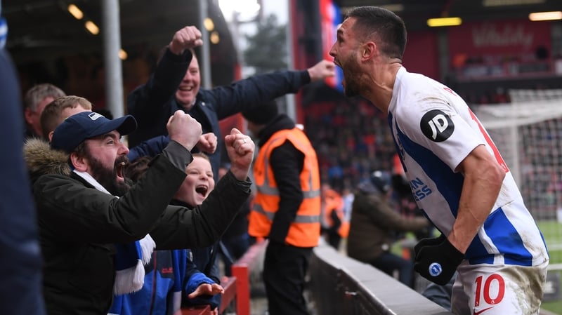 Florin Andone celebrates with Brighton fans