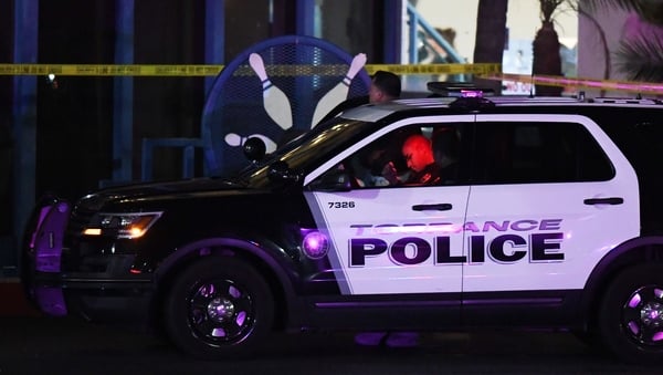 Police guard the Gable House Bowl centre in Torrance, California