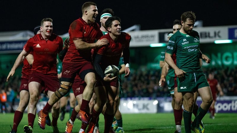 Joey Carbery is mobbed after scoring his try