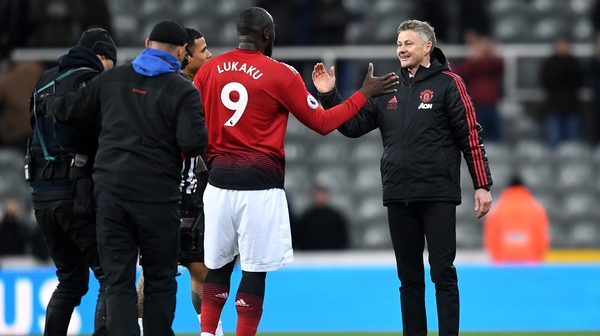 Romelu Lukaku (C) celebrates beating Newcastle with Ole Gunnar Solskjaer (R)