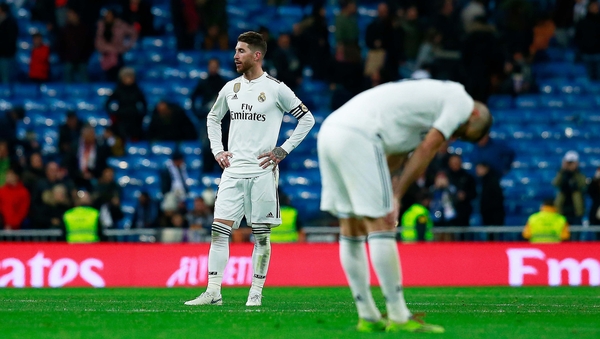Sergio Ramos and team-mate Karim Benzema react as they leave the pitch after Real Madrid lose to Real Sociedad