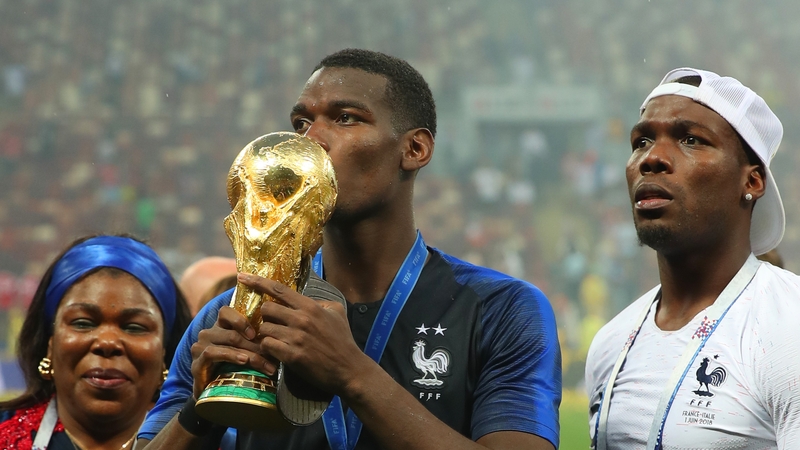 Pogba of France celebrates victory with mother Yeo and brother Mathias
