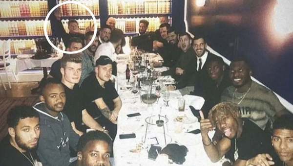 Hennessy, back left, making the disputed gesture