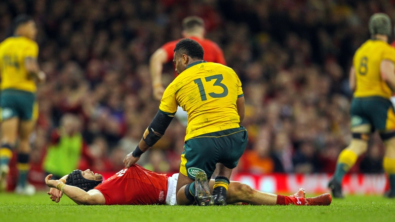 Samu Kerevi with Halfpenny after the tackle that left the Welsh man concussed