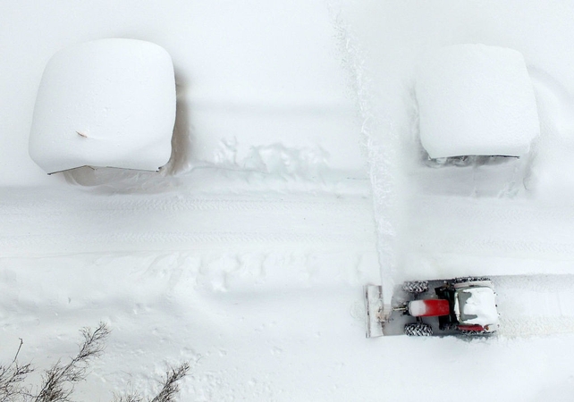 Aerial view shows a snow plough clearing the area in Ramsau am Dachstein, Austria. Up to 1.5 metres of snow has fallen in central and north Austria since the middle of last week