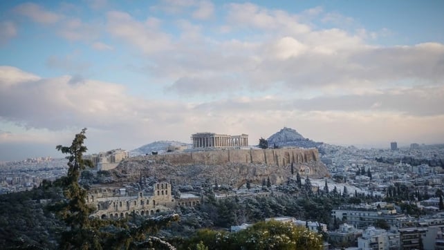 A general view of the Acropolis Hill (L) and Lykavvitos Hill (R) covered with snow. A snow storm over Athens is keeping the mercury far below zero