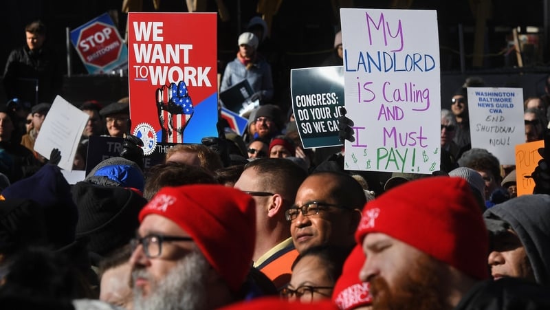 US federal workers have held protests calling for the partial shutdown to end