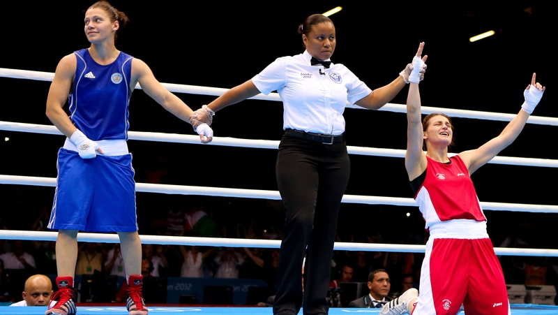 Katie Taylor (R) celebrates after being declared Olympic champion