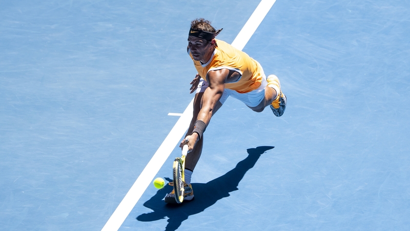 Rafa Nadal hits a backhand in his first round match against James Duckworth