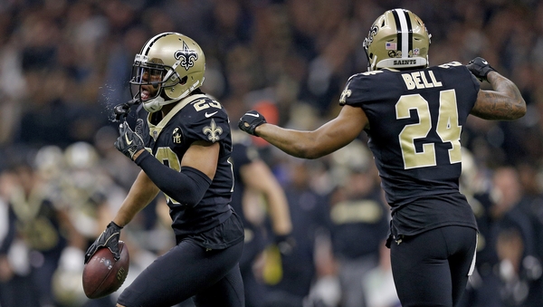 Marshon Lattimore is congratulated by his teammate Vonn Bell after a second quarter interception