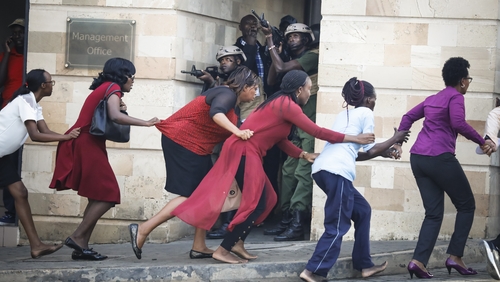 Woman are evacuated from the scene of the attack