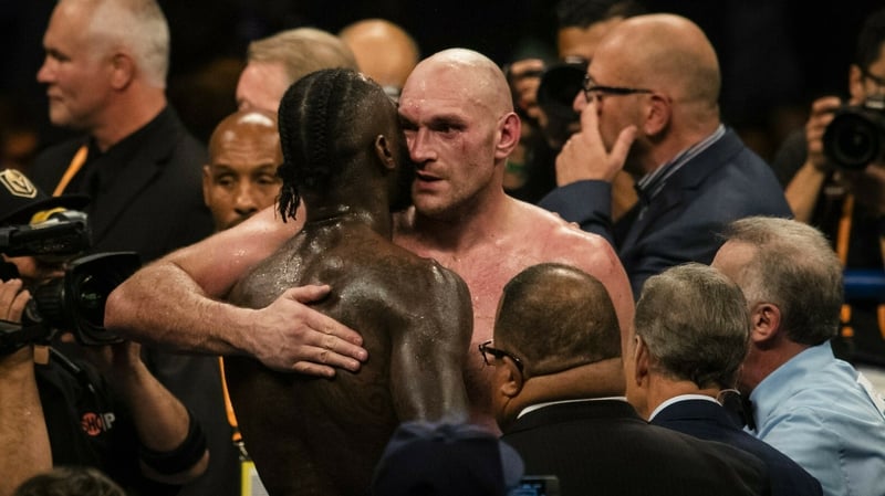 Deontay Wilder and Tyson Fury embrace after their fight in December