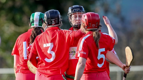 Cork players celebrate after their tight victory over Tipperary.