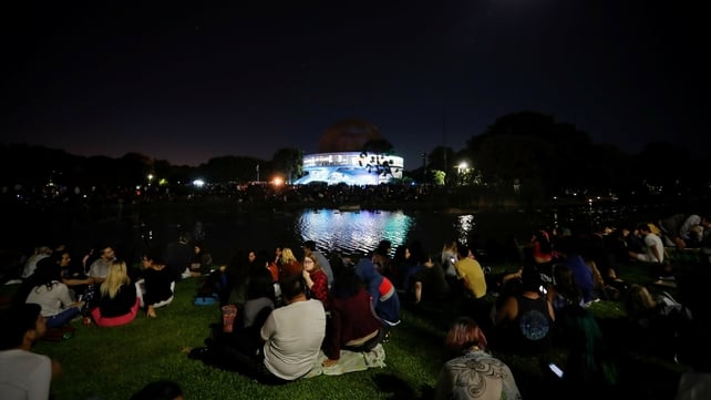 Hundreds of people meet at the planetary to see the first total moon eclipse of the year in Buenos Aires, Argentina