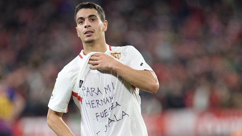 Sevilla's French forward Wissam Ben Yedder shows a t-shirt reading "To my brother, be strong, E. Sala" supporting the missing Emiliano Sala last night