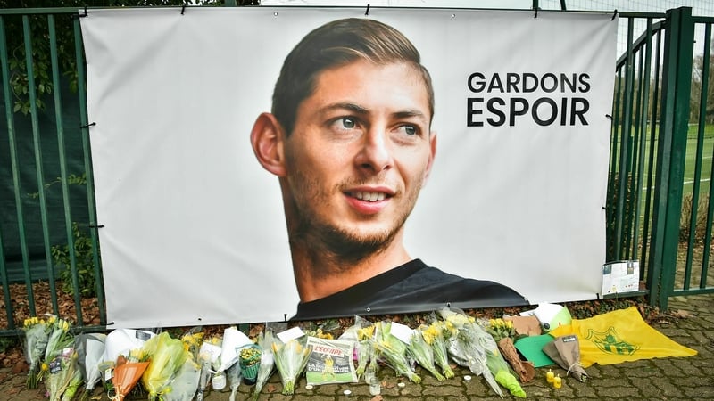 Flowers alaid under a portrait of Argentinian forward Emiliano Sala at FC Nantes training centre La Joneliere
