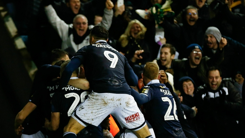 Millwall players and fans celebrate their late winner against Everton