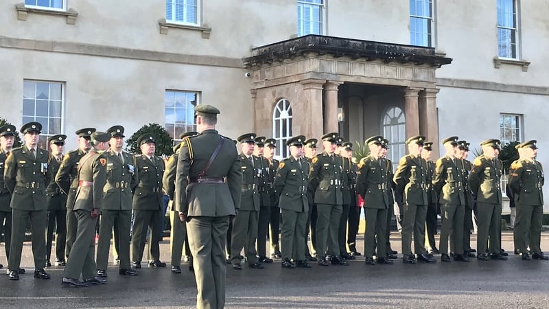 Soldiers march in front of Rockhill House, a decade after the barracks was closed down
