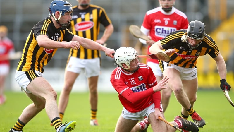 Kilkenny's Billy Ryan and Enda Morrissey tackle Luke Meade of Cork