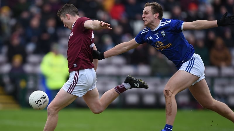 Galway's Johnny Heaney with Padraig Faulkner of Cavan