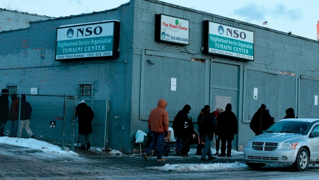 People gather at Neighborhood Service Organization in Detroit - warming centres have been opened in many cities