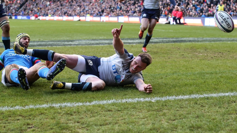 Stuart Hogg dives over for Scotland's third try against Italy