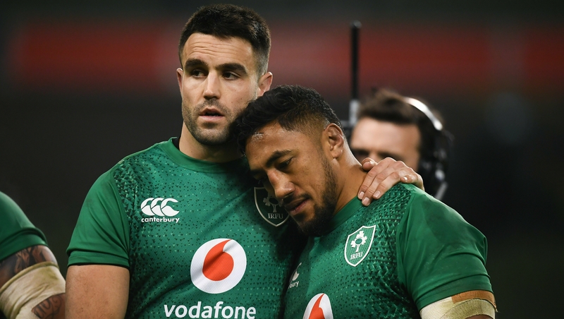Conor Murray consoles Bundee Aki after the defeat to England