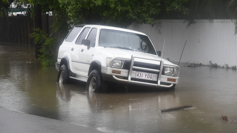 Thousands of residents in Townsville were without power and cut off by flooded roads