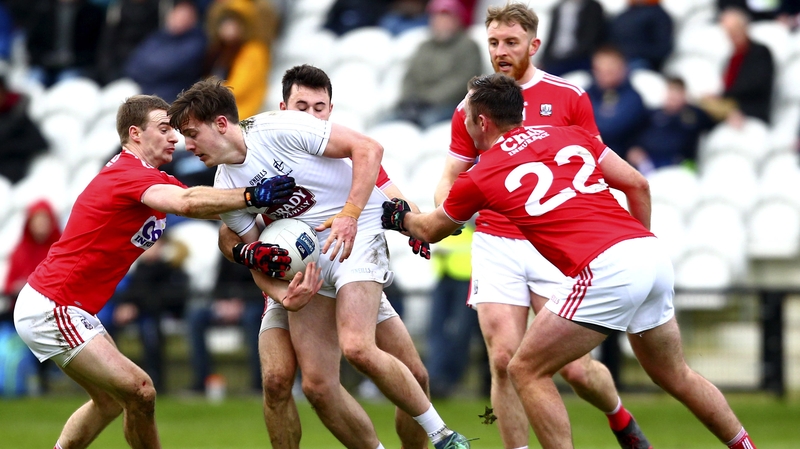 Kildare's Cian O'Donoghue being put under pressure at Páirc Uí Chaoimh