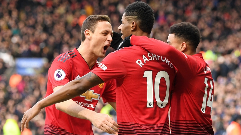 Manchester United players celebrate their goal