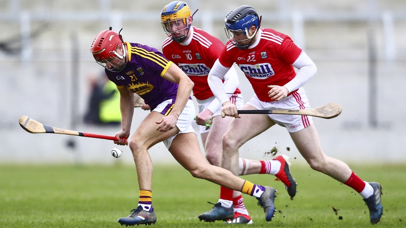 Paul Morris and Conor Lehane scrap for possession at Pairc Ui Chaoimh