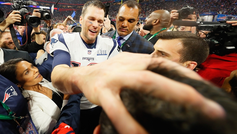 The hand of Tom: Brady celebrates the Patriots' glory