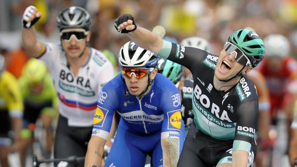 Sam Bennett (R)punches the air in celebration after winning the final stage of the Vuelta a San Juan Internacional