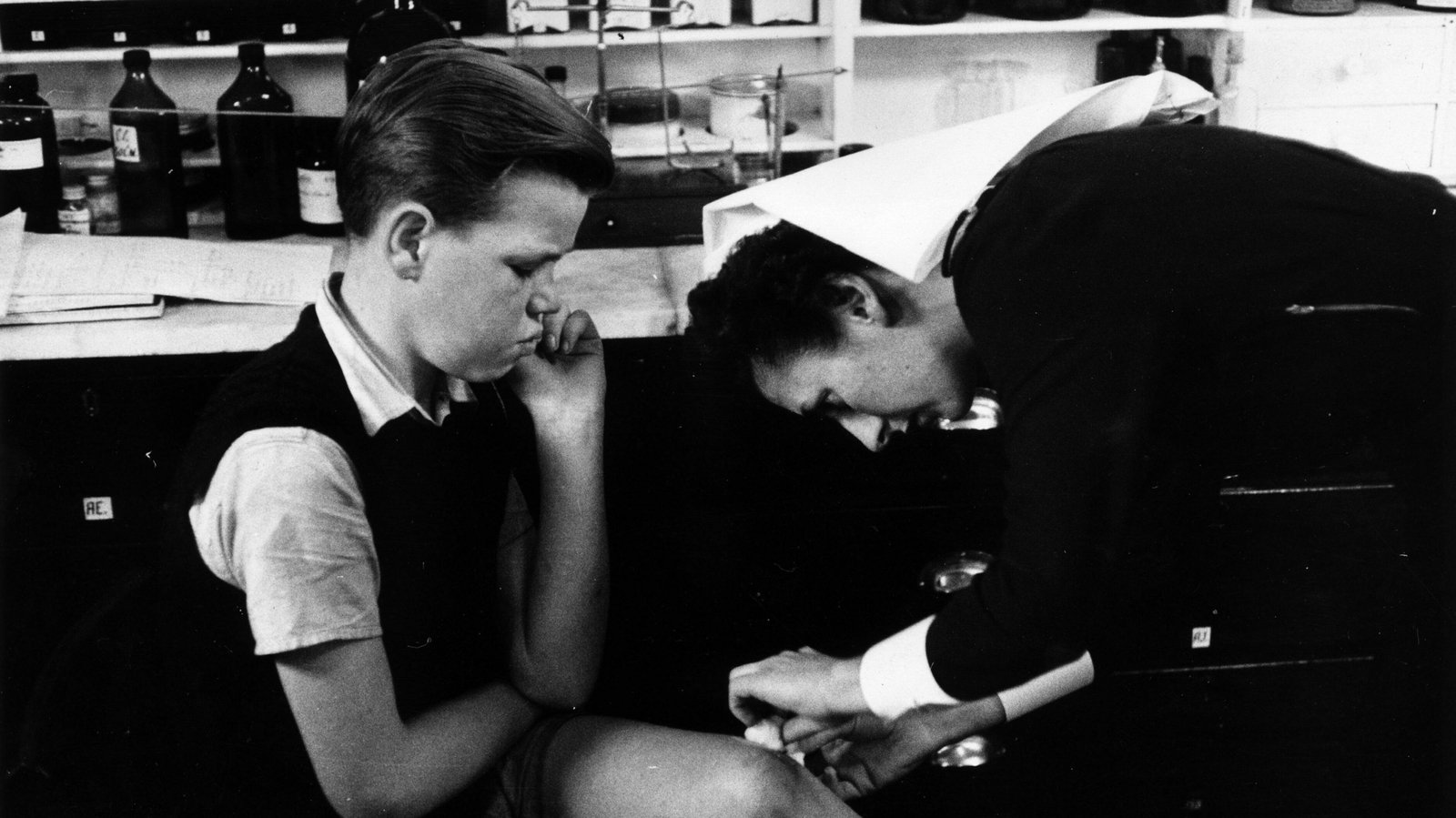 A ship's nurse attending to a stowaway in 1956. Photo: Bert Hardy/ Picture Post/Getty Images