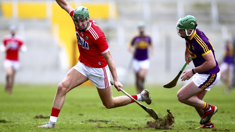 Cork's Aidan Walsh is caught in the Páirc Uí Chaoimh pitch while avoiding Wexford's Darren Byrne