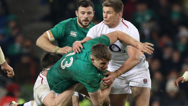 Garry Ringrose is tackled by England's Tom Curry and Owen Farrell
