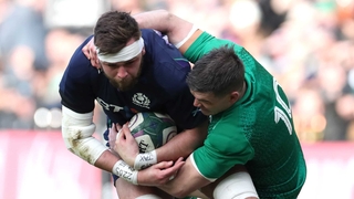 Scotland's Ryan Wilson is tackled by Jonathan Sexton
