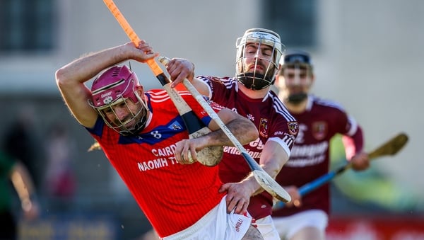 James Regan and Neil McManus tussle for the ball
