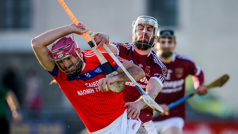 James Regan and Neil McManus tussle for the ball