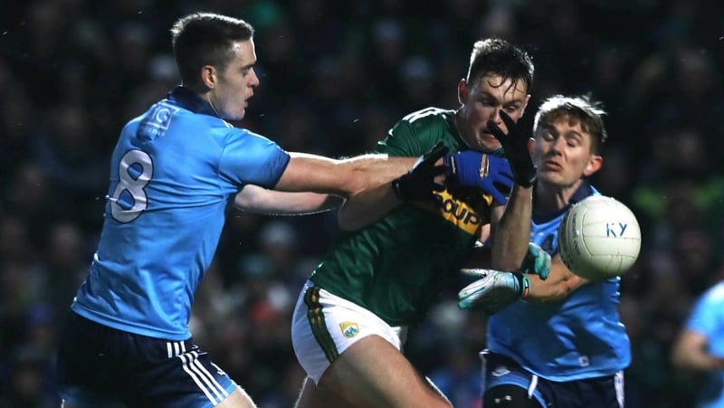 Kerry's Gavin O'Brien tackled by Brian Fenton and Michael Fitzsimons