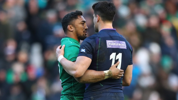 Bundee Aki and Seán Maitland embrace after the full-time whistle at BT Murrayfield