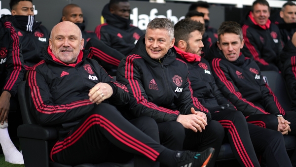 Mike Phelan joins manager Ole Gunnar Solskjaer in signing a contract that will keep him at Old Trafford until 2024