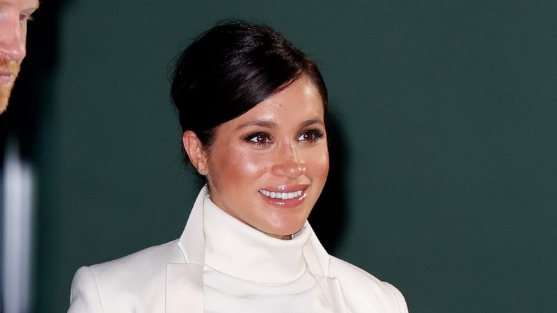 Meghan Markle was glowing in pale cream. Photo: Getty