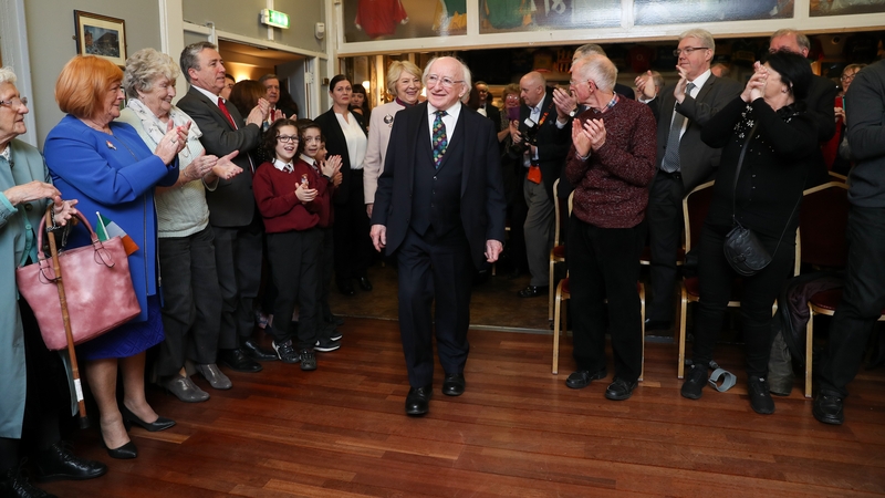 The crowd rose to their feet in applause as President Higgins and Sabina arrived
